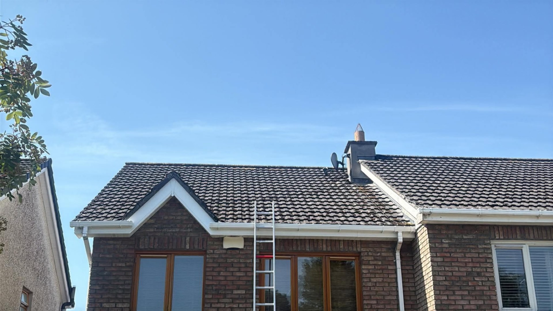 Same roof cleaned back to dark, even tiles after moss removal